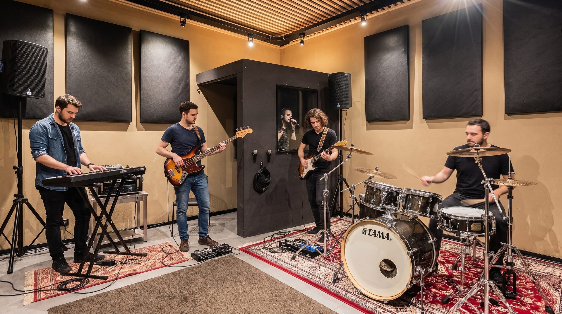 A band with keys, bass, guitar and drums in a Temple Studios room